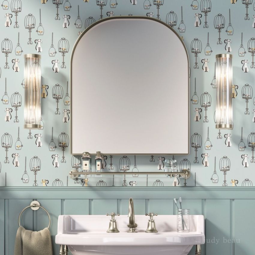 Traditional style bathroom mockup featuring a white sink, arched mirror, and blue wallpaper with playful cat and birdcage designs.