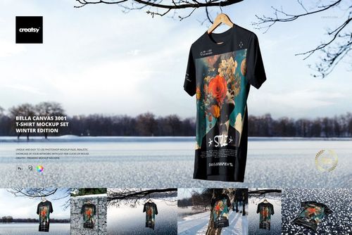 Front view of a black t-shirt mockup with vibrant flower design, displayed outdoors over icy lake and snowy landscape.