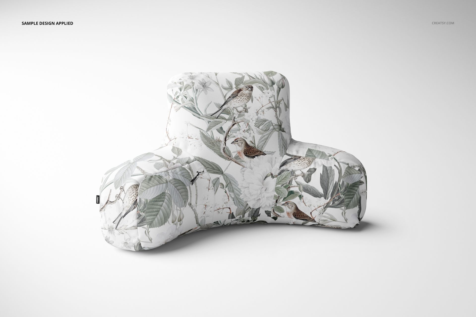 Botanical-themed reading pillow mockup featuring soft velvet and polyester fabric with birds and leaves design.