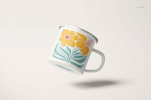 360ml enamel mug mockup with silver rim, decorated with bold yellow flowers and teal foliage, angled side view.