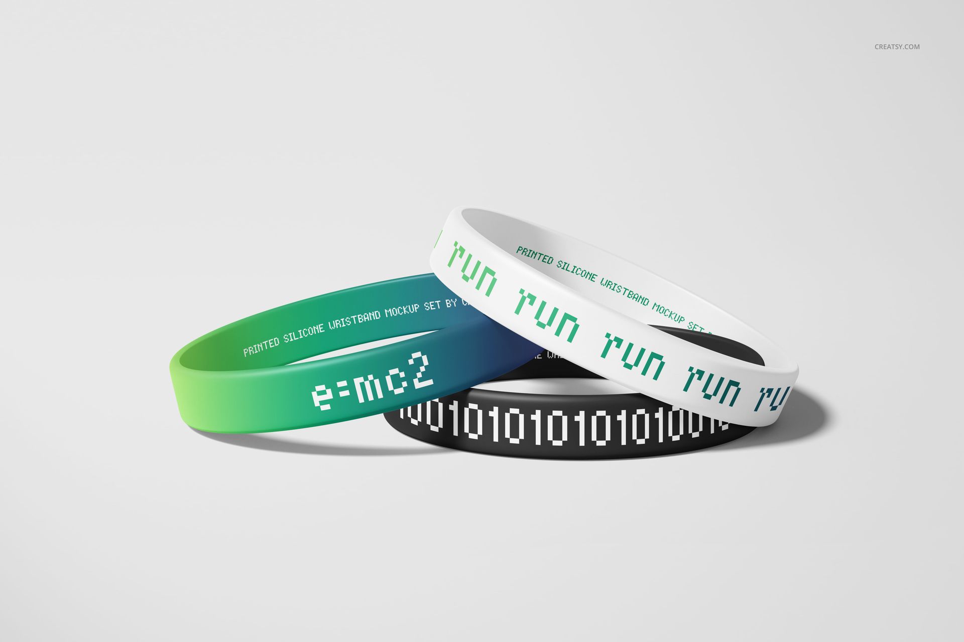 Set of three silicone wristbands mockup featuring green, black, and white bands with various printed patterns and text.
