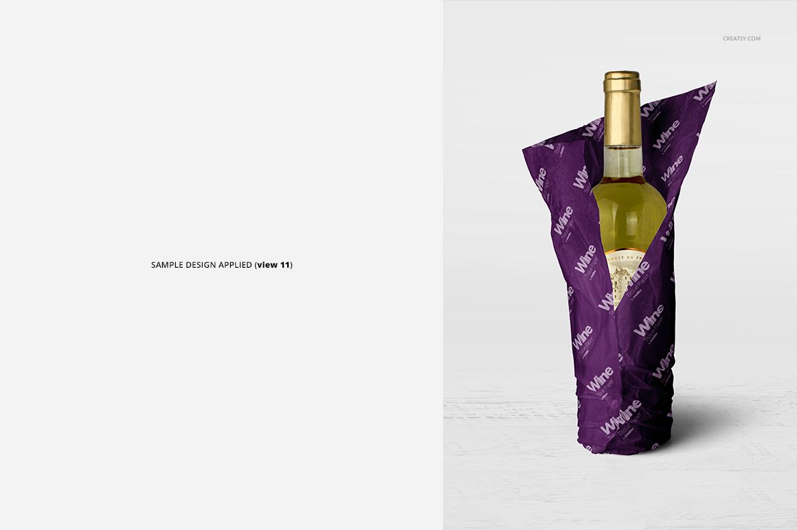 PSD mockup showing a wine bottle wrapped in dark purple tissue paper with white print, upright against a neutral backdrop.