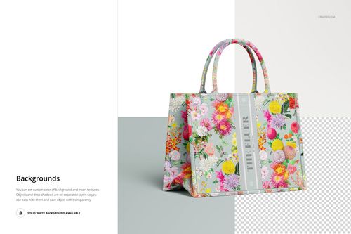 Front view of a canvas tote bag mockup with colorful floral pattern, placed on a split white and gray background.