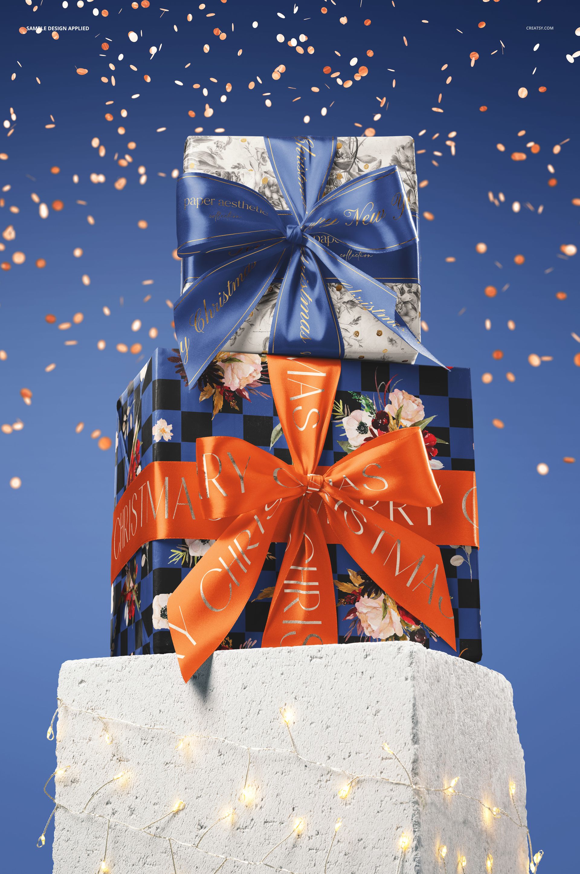 PSD mockup showing two wrapped holiday gifts with colorful ribbons, placed on a textured pedestal under falling confetti.