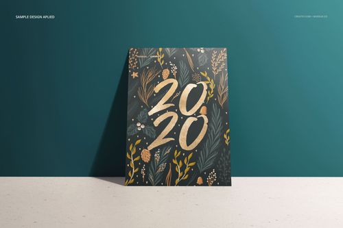 Front view of a vertical card mockup with gold and white botanical design and large 2020 numbers on a dark background.