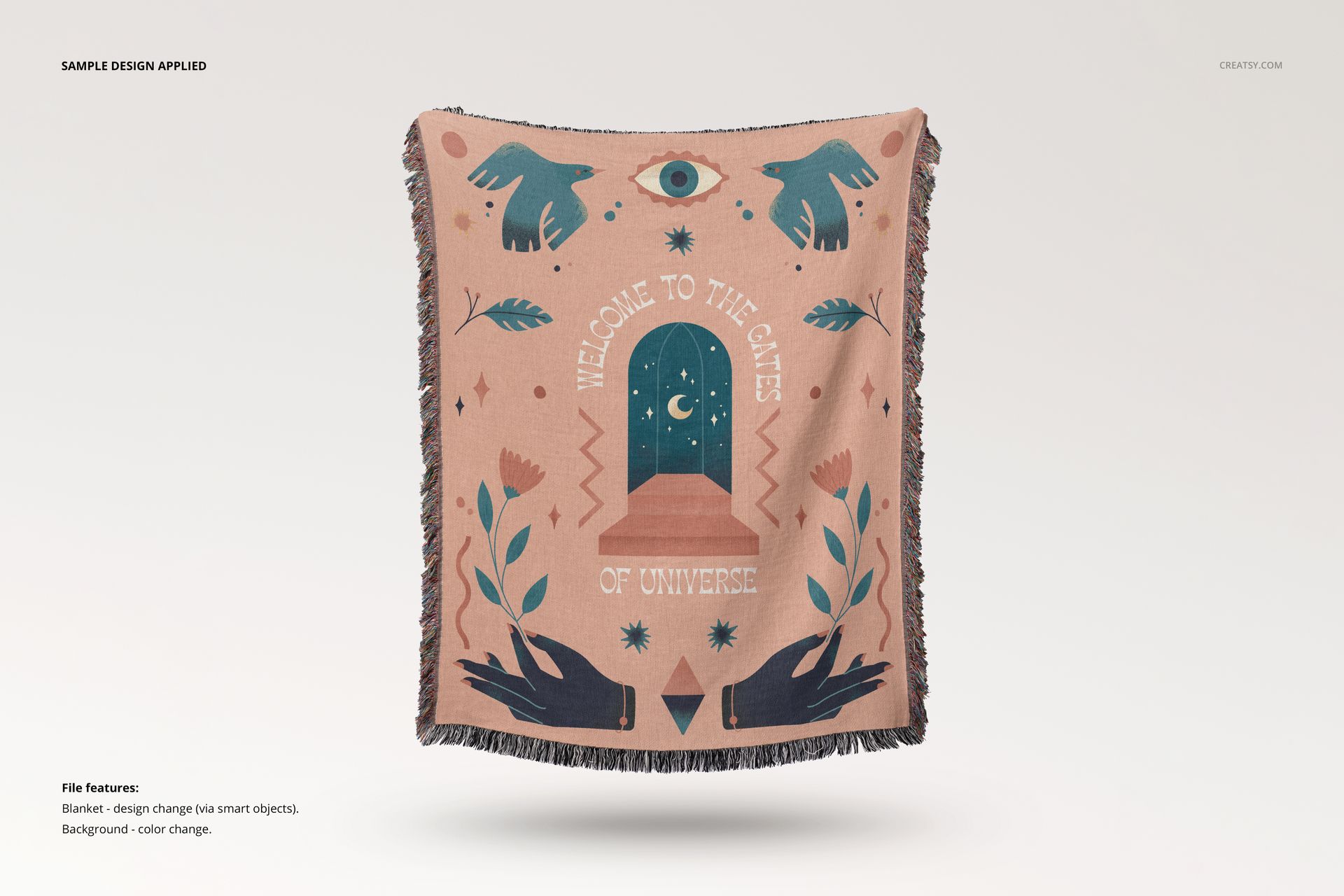 Fringed woven throw blanket mockup with a pink base, mystical symbols, and dark blue accents, front view on plain background.