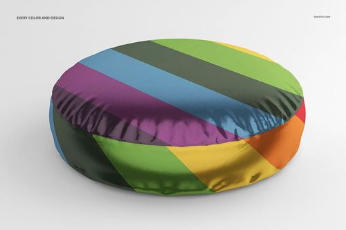 Mockup of a circular shiny pillow with multicolored diagonal stripes, displayed from a front angle on a plain surface.