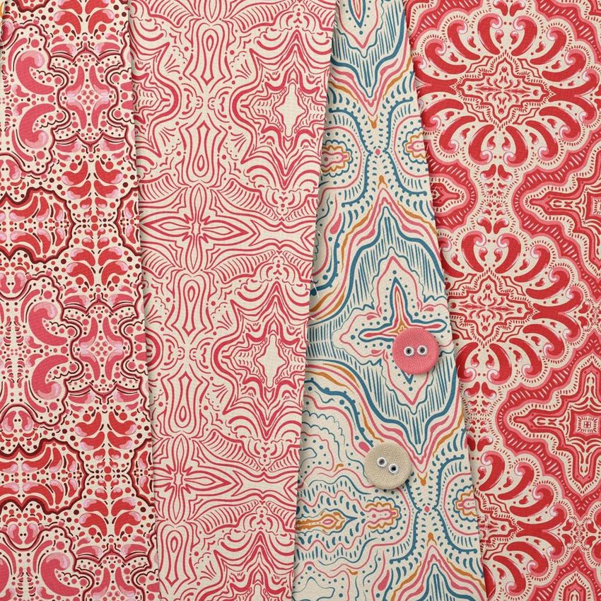 Cotton fabric sample mockup featuring four pieces of patterned fabric in red and blue tones, arranged side by side.