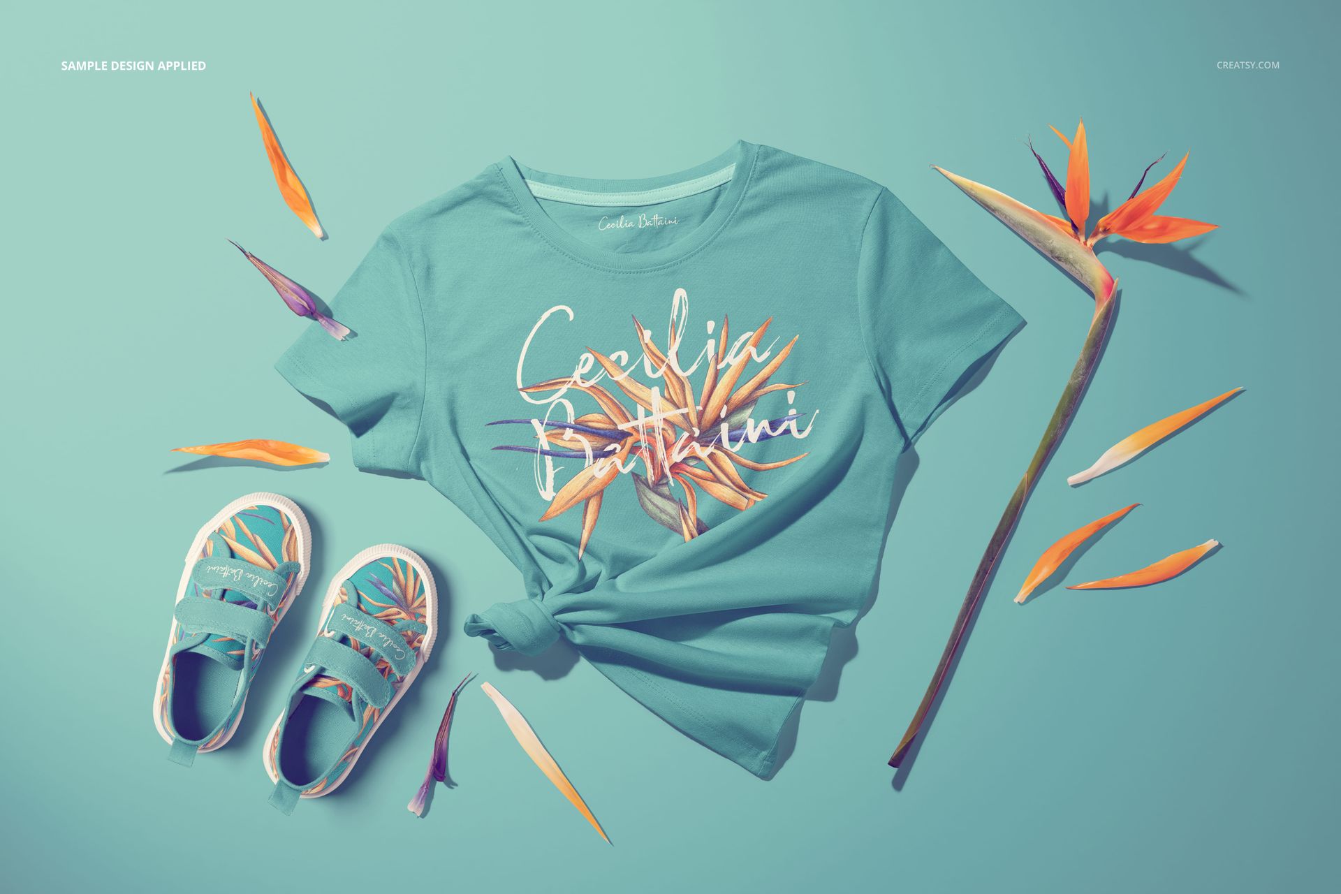PSD mockup showing teal kids T-shirt and shoes surrounded by orange and purple floral elements on blue.