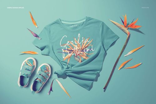PSD mockup showing teal kids T-shirt and shoes surrounded by orange and purple floral elements on blue.