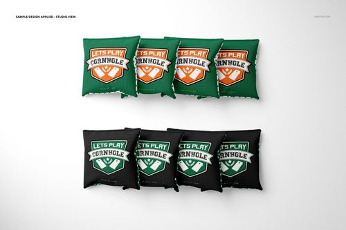 Cornhole bags mockup set displayed in studio lighting, with four green and four black bags, each showing a sports-themed design.