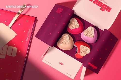 Valentine's Day packaging mockup featuring heart-shaped containers in pink and red tones, viewed from above.