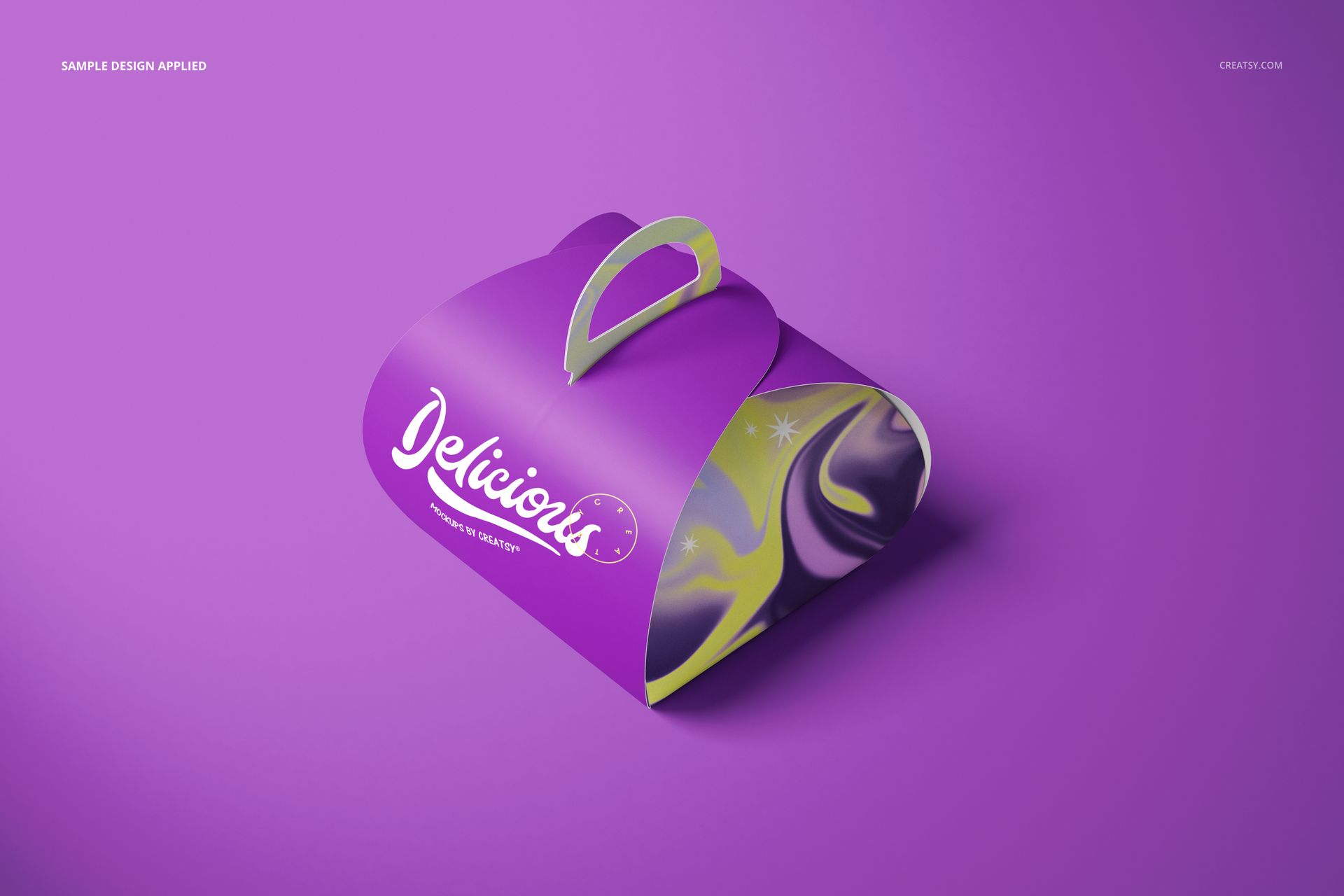 Purple curved cake box mockup with a yellow handle and swirling pattern, displayed on a solid purple background.