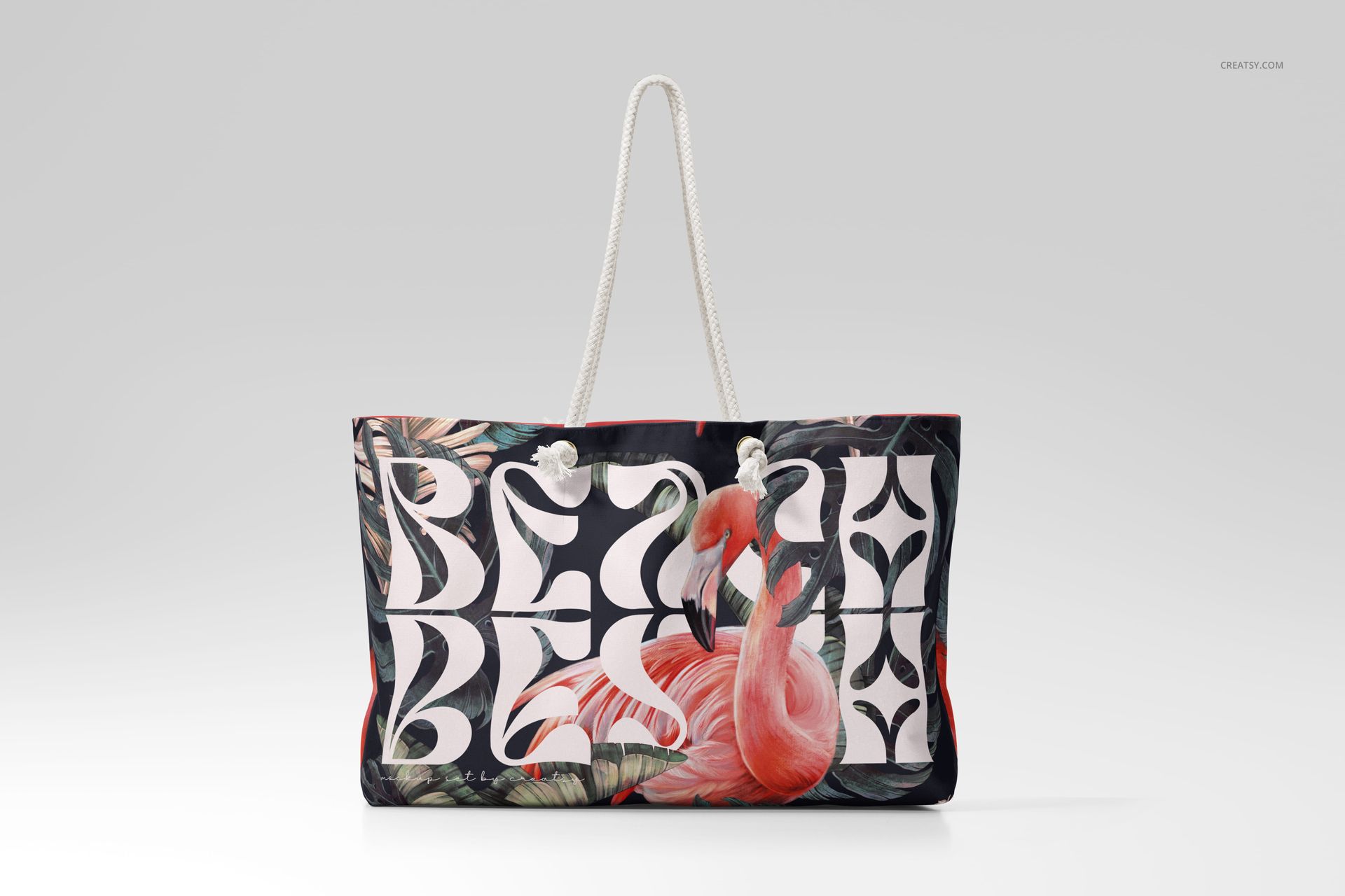 Spun polyester weekender bag mockup with bold BEACH lettering, flamingo artwork, and botanical accents, front view.