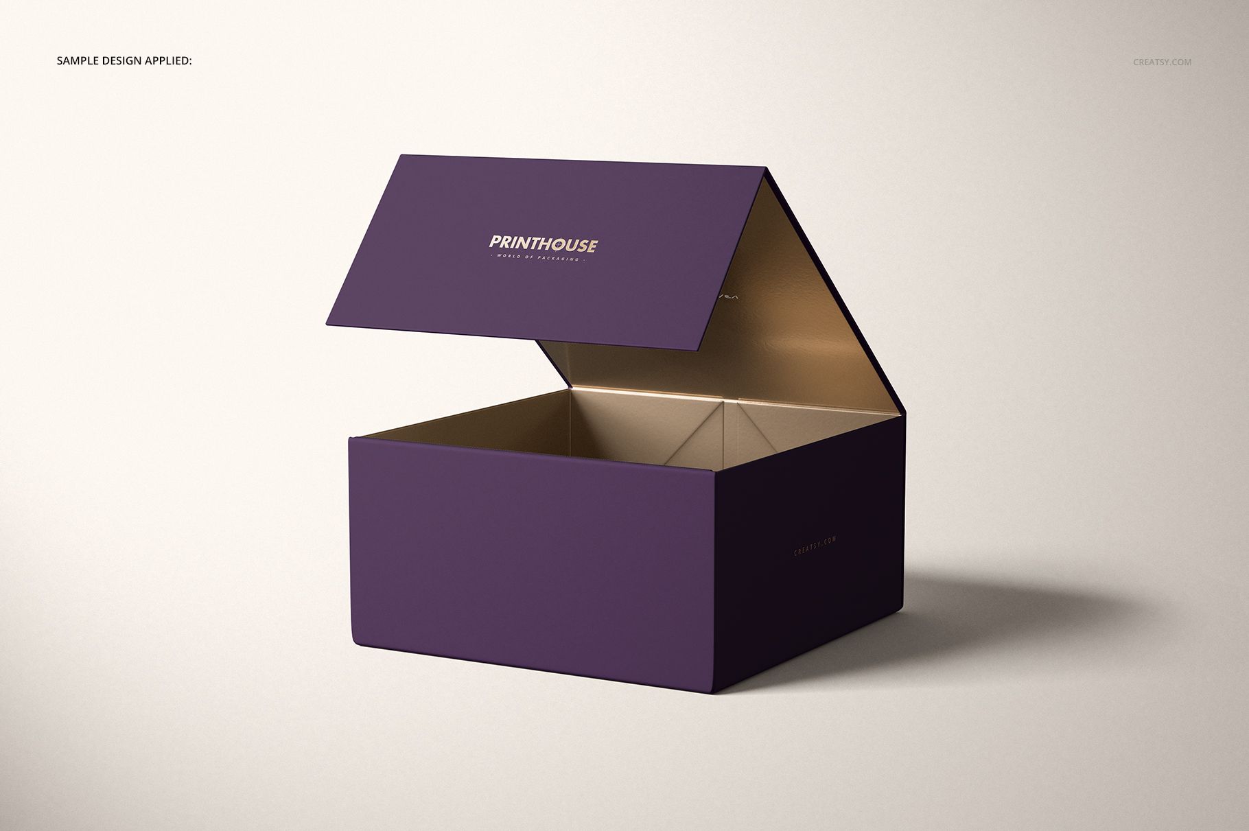 PSD mockup of a rectangular magnetic gift box with open lid, purple outside and metallic gold inside on a neutral background.