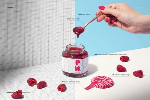 Front view of a raspberry jam jar mockup with customizable label, spoon, and scattered raspberries on a split background.