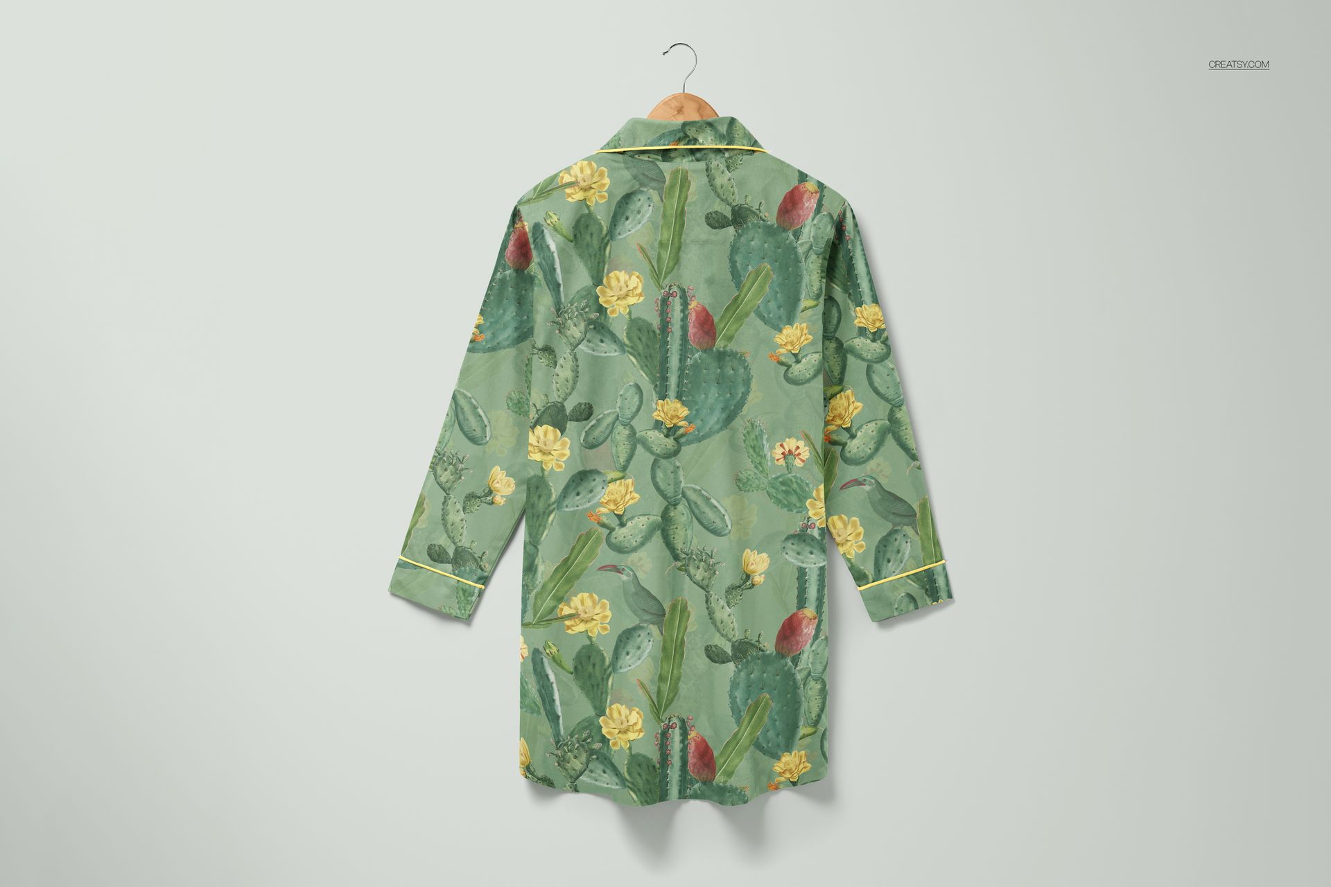 Floral cactus patterned nightdress mockup displayed on a wooden hanger against a light background, rear perspective.
