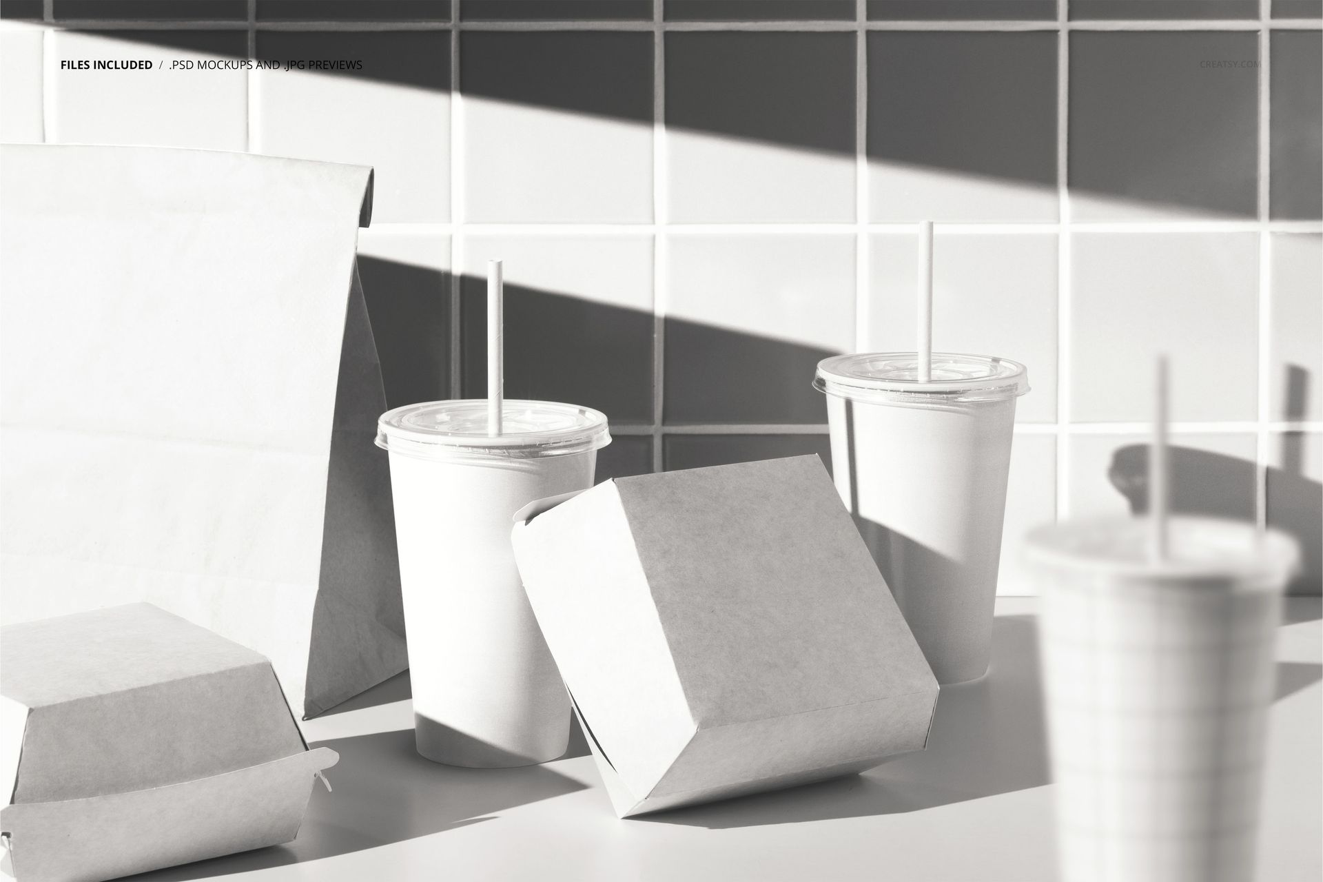 Fast food restaurant packaging mockup featuring blank burger boxes, paper bag, and drink cups on a white countertop.