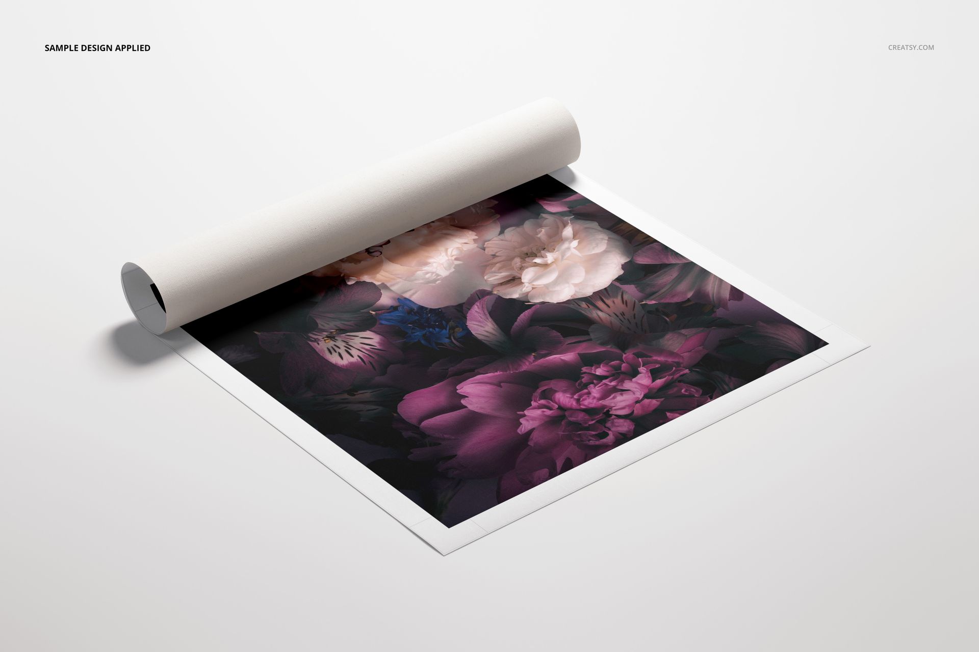 Rolled canvas print mockup featuring a vivid flower pattern in purple and beige, shown partially unrolled on white.