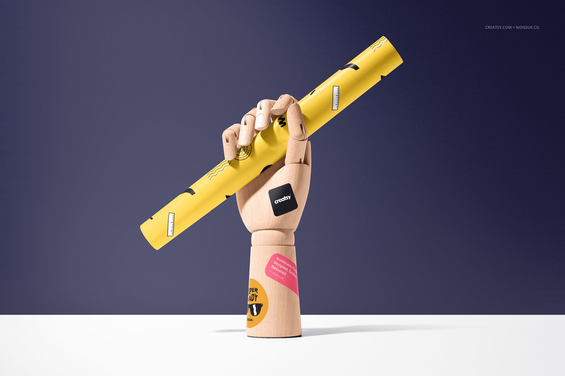 Front view of a wooden hand model gripping a rolled yellow sheet, representing a food safe paper mockup scene.