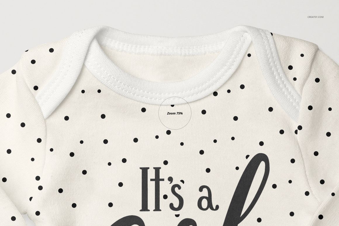 Detailed mockup of a baby long sleeve onesie in white with scattered black dots, shown from the front at an angle.