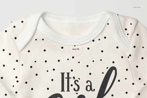 Detailed mockup of a baby long sleeve onesie in white with scattered black dots, shown from the front at an angle.