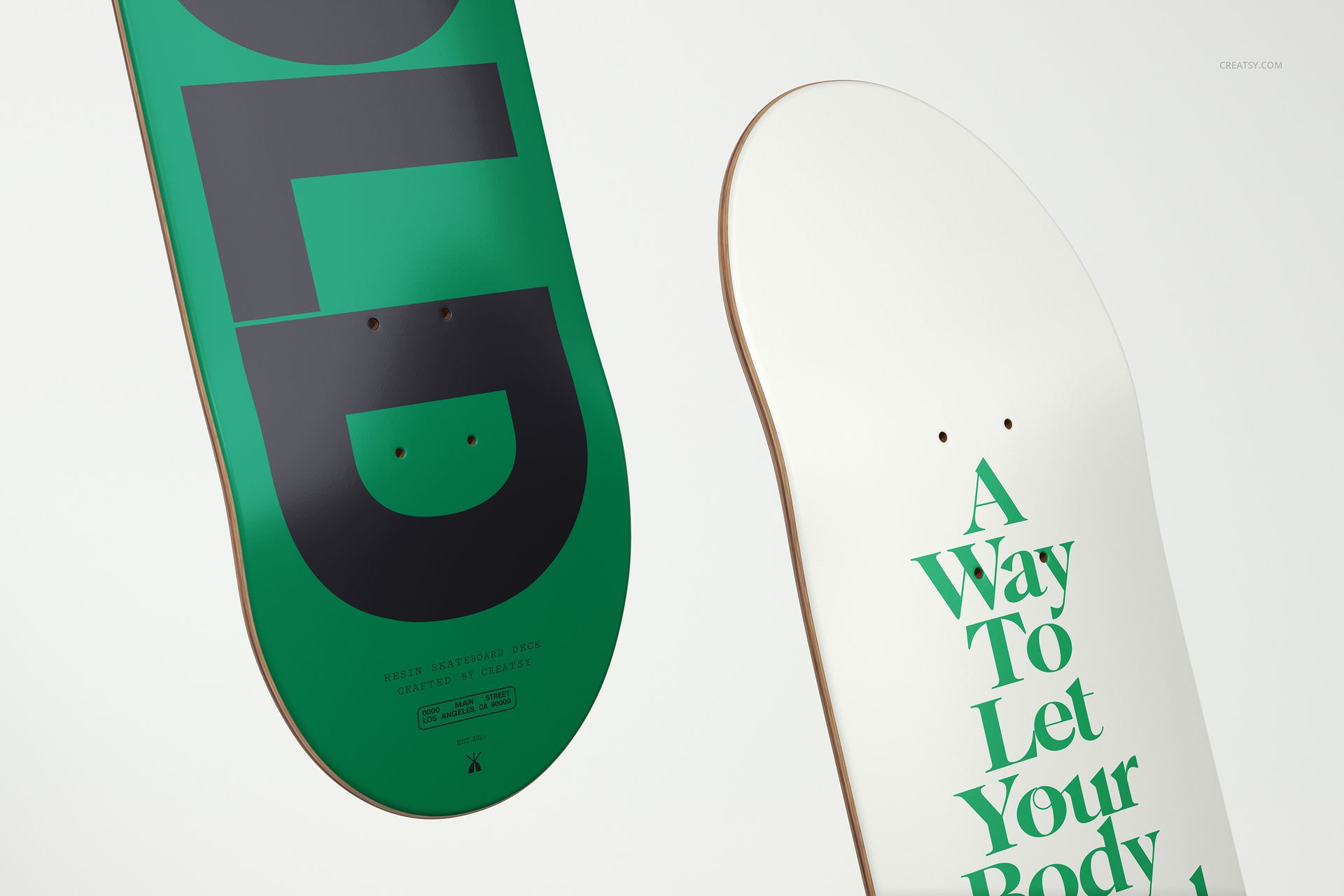 Skateboard deck mockup featuring a green deck with large black letters and a white deck with green typography.