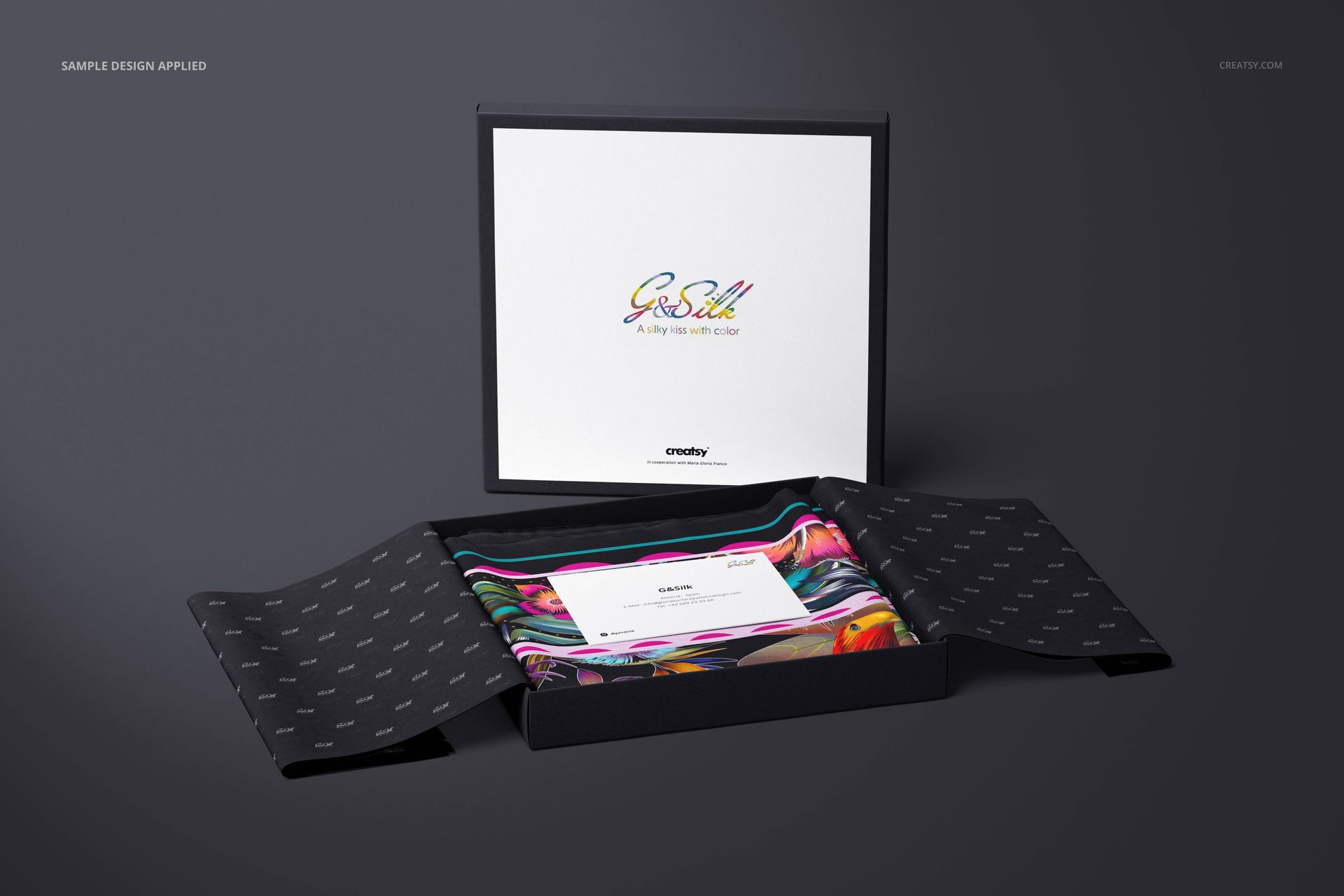 Lightweight cashmere scarf mockup set in a black box, showing multicolored fabric and an informational card.