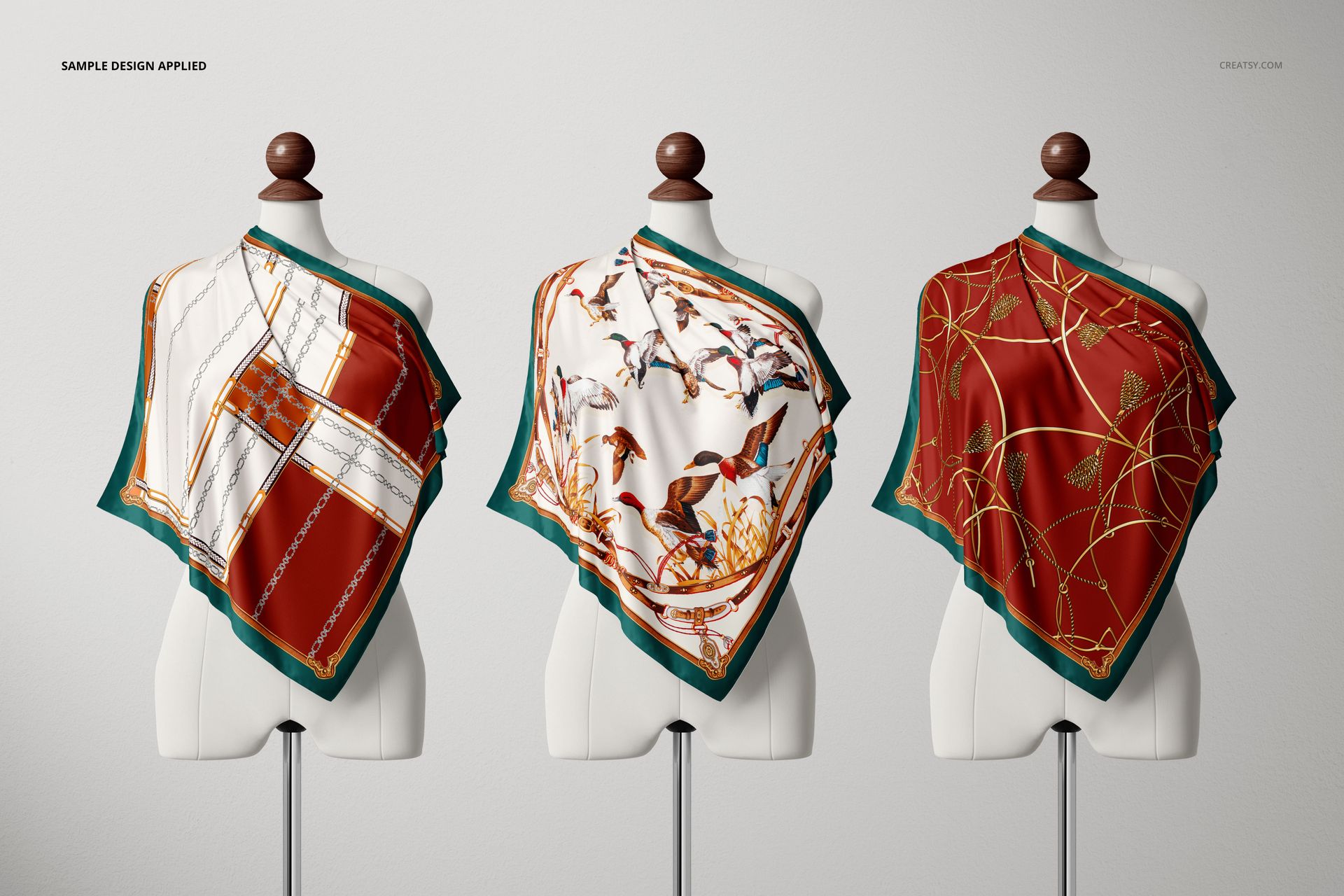 Silk scarf mockup featuring three mannequins, each draped with a distinct patterned scarf, neutral backdrop.