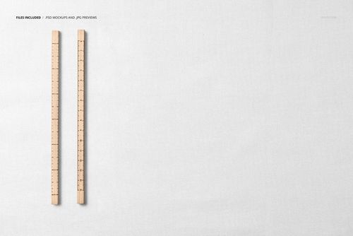 PSD mockup showing a flat lay of plain white jersey fabric with two wooden rulers aligned vertically.