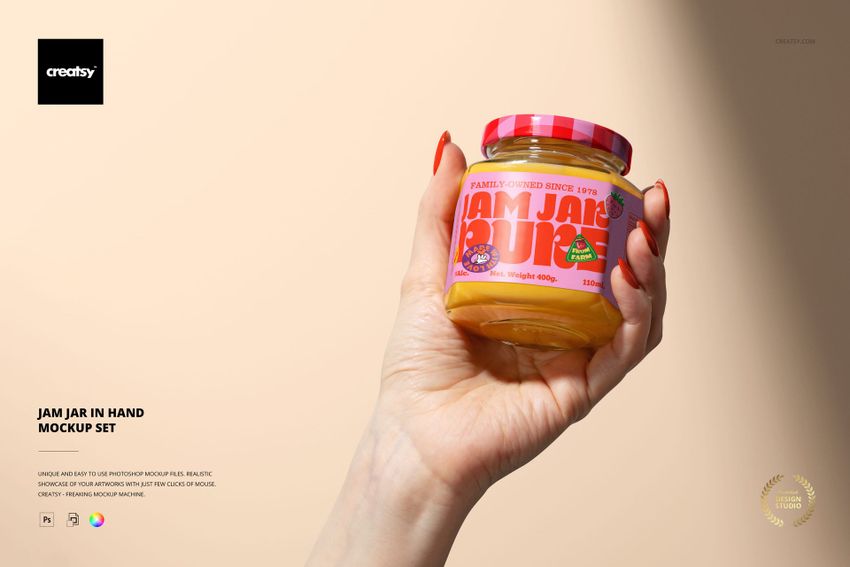 PSD mockup featuring a clear jam jar filled with yellow jam, held in a hand, with a playful pink lid and label design.