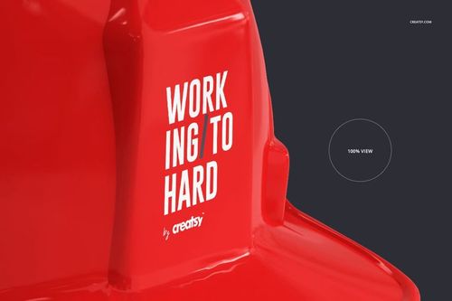 Close-up front view of a red hard hat with bold white text, displayed on a dark background for a construction mockup.