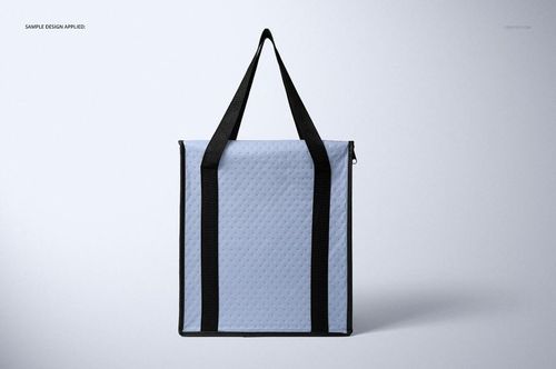 Front view of a square insulated cooler bag mockup with light blue quilted texture and black handles on a plain background.