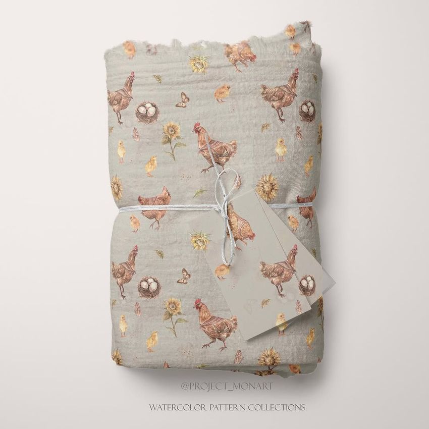 Muslin swaddle blanket mockup featuring a folded fabric with watercolor chickens, sunflowers, and eggs on a light background.