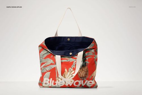PSD mockup of a market tote bag featuring white handles and a vibrant red design with tropical foliage and pineapples.