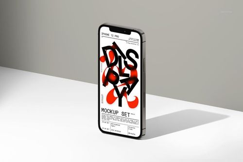 iPhone 12 Pro standing upright on a white surface, displaying a mockup screen with bold black and red text.