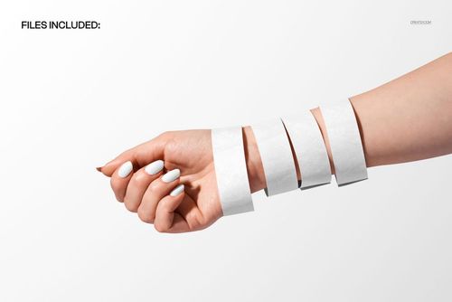 PSD mockup of multiple white festival wristbands on a hand, fingers slightly bent, isolated on solid background.