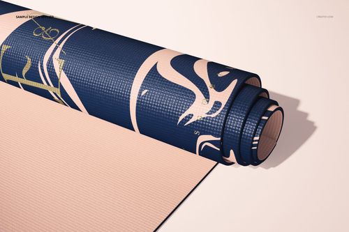 Yoga mat mockup displaying a rolled mat with geometric navy and beige design, photographed from a side angle.