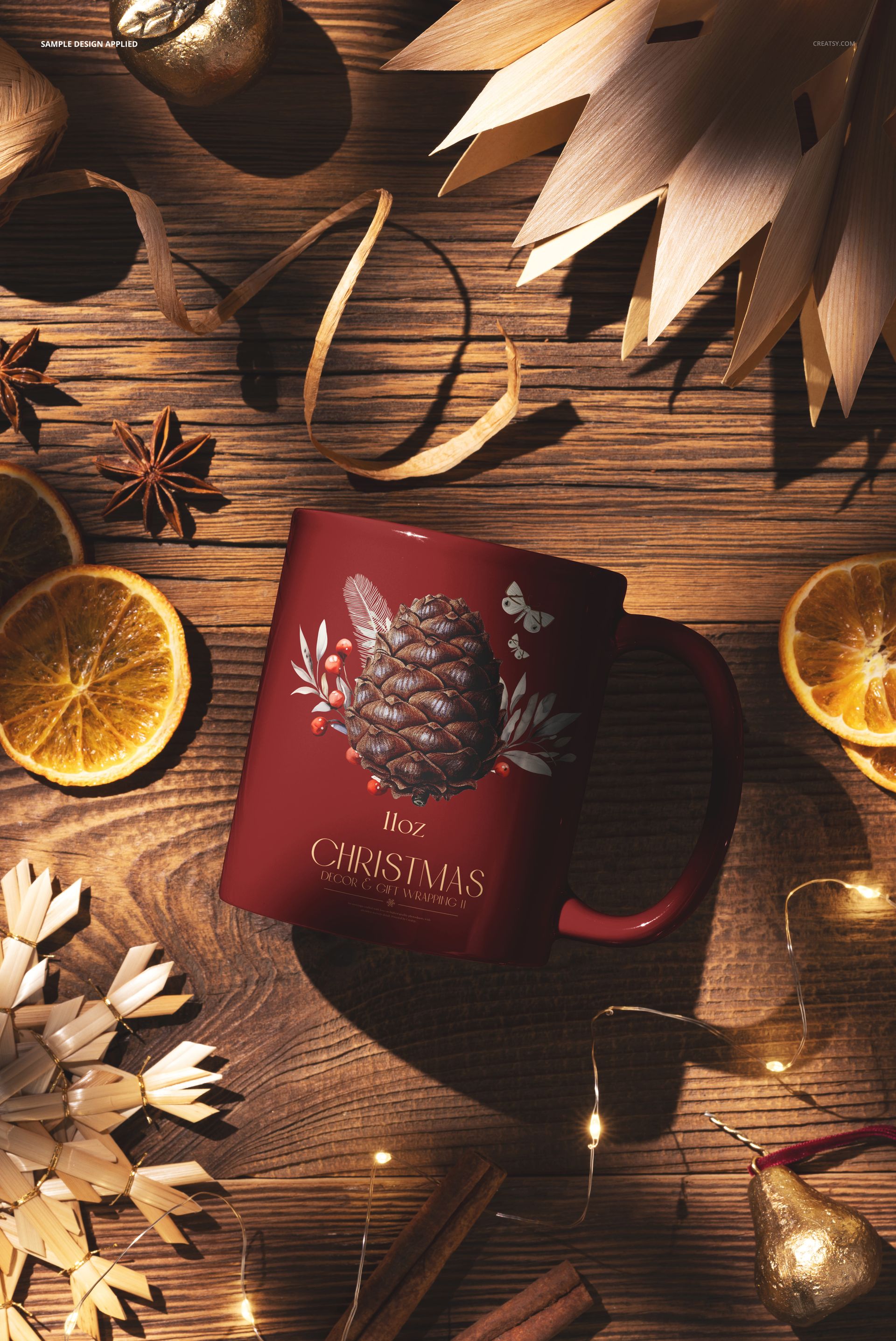 Christmas-themed 11 oz mug mockup with pinecone design, placed on a wooden kitchen countertop with festive decorations.