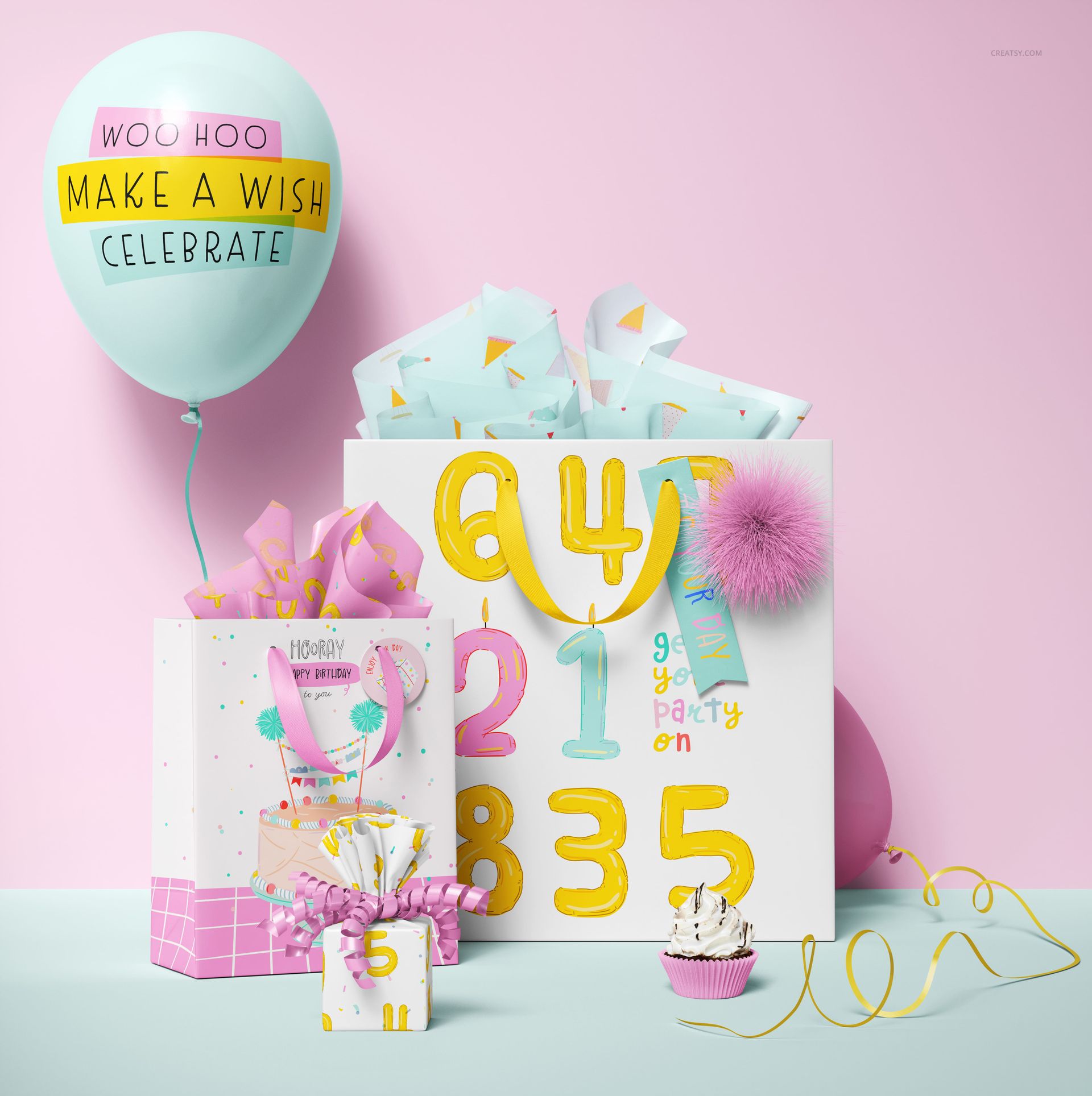 PSD mockup set featuring festive paper gift bags, pastel balloon, wrapped gifts, and party props against a pink wall.