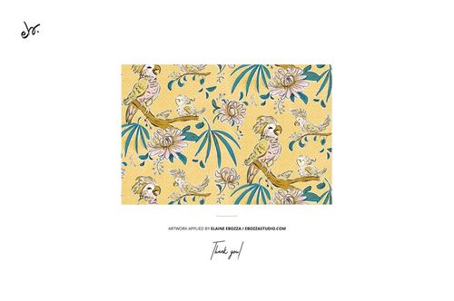 Yellow textile mockup featuring illustrated parrots and flowers, displayed in a centered flat layout with white space.