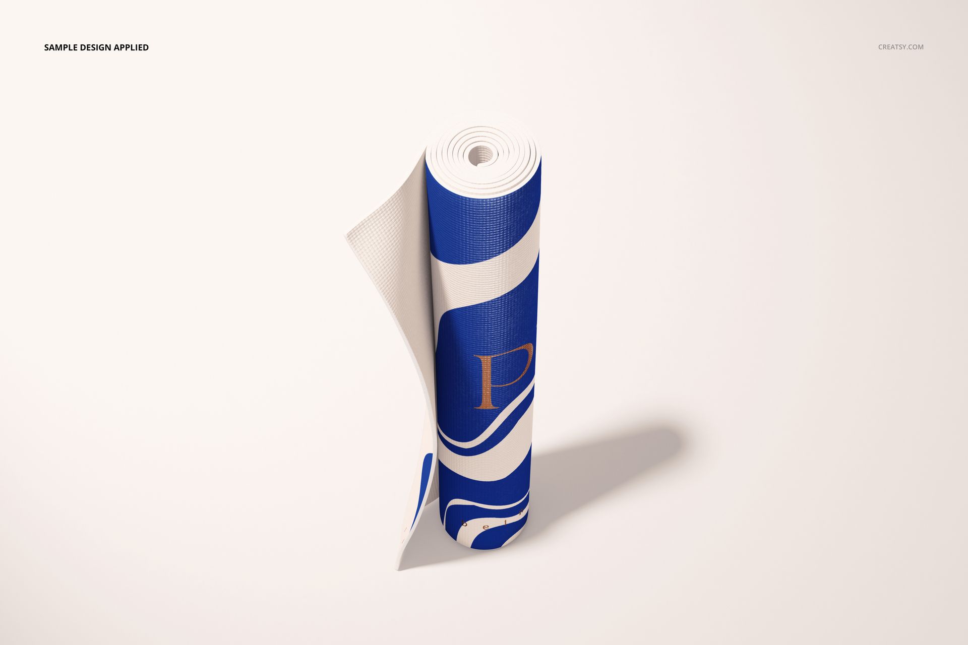 Yoga mat mockup featuring a rolled mat with blue and white abstract design, shown from a slightly elevated front view.