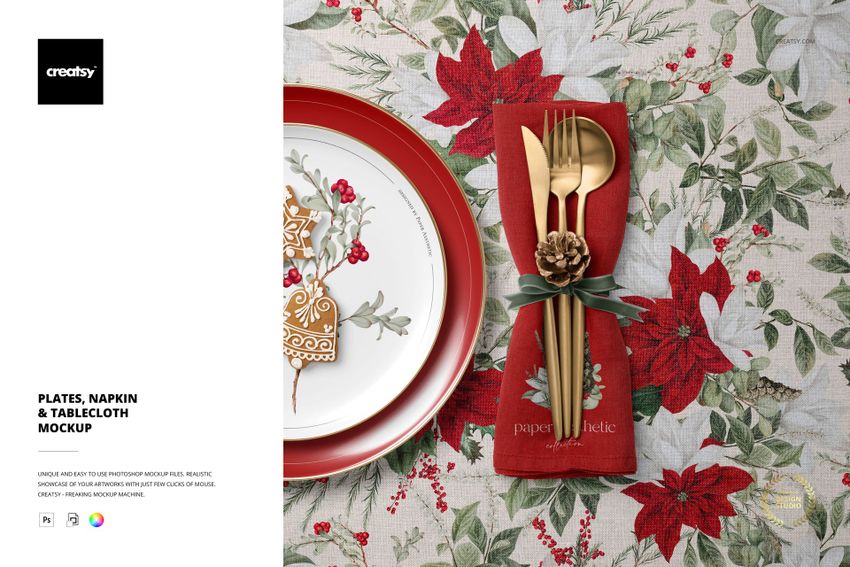 Christmas-themed PSD mockup showing a gingerbread plate, floral tablecloth, and gold utensils wrapped in a red napkin.