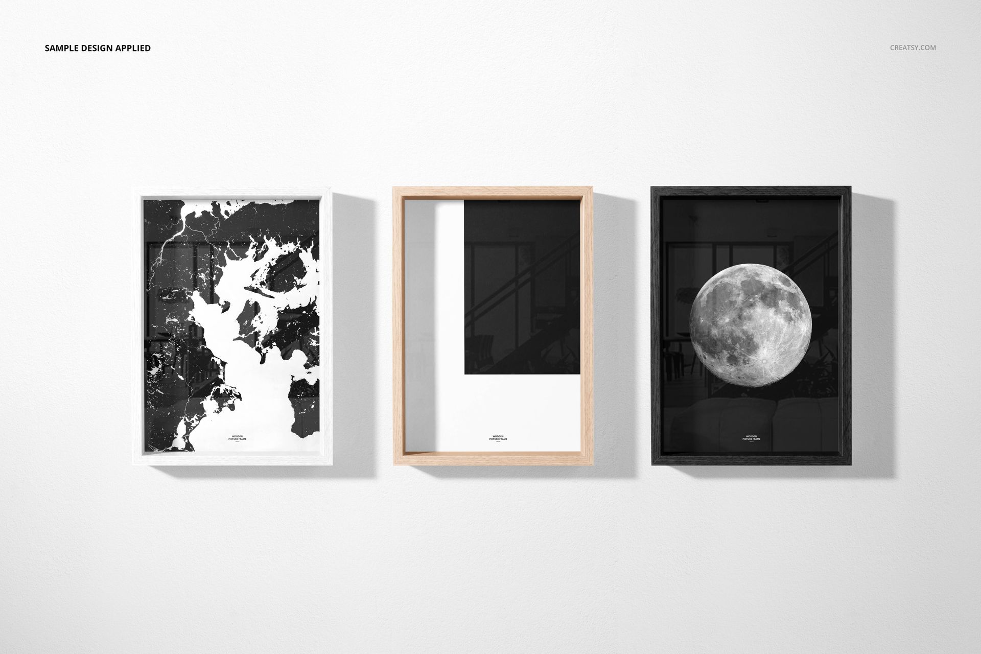 PSD mockup featuring a trio of vertical wooden picture frames with abstract and moon-themed designs, arranged side by side.