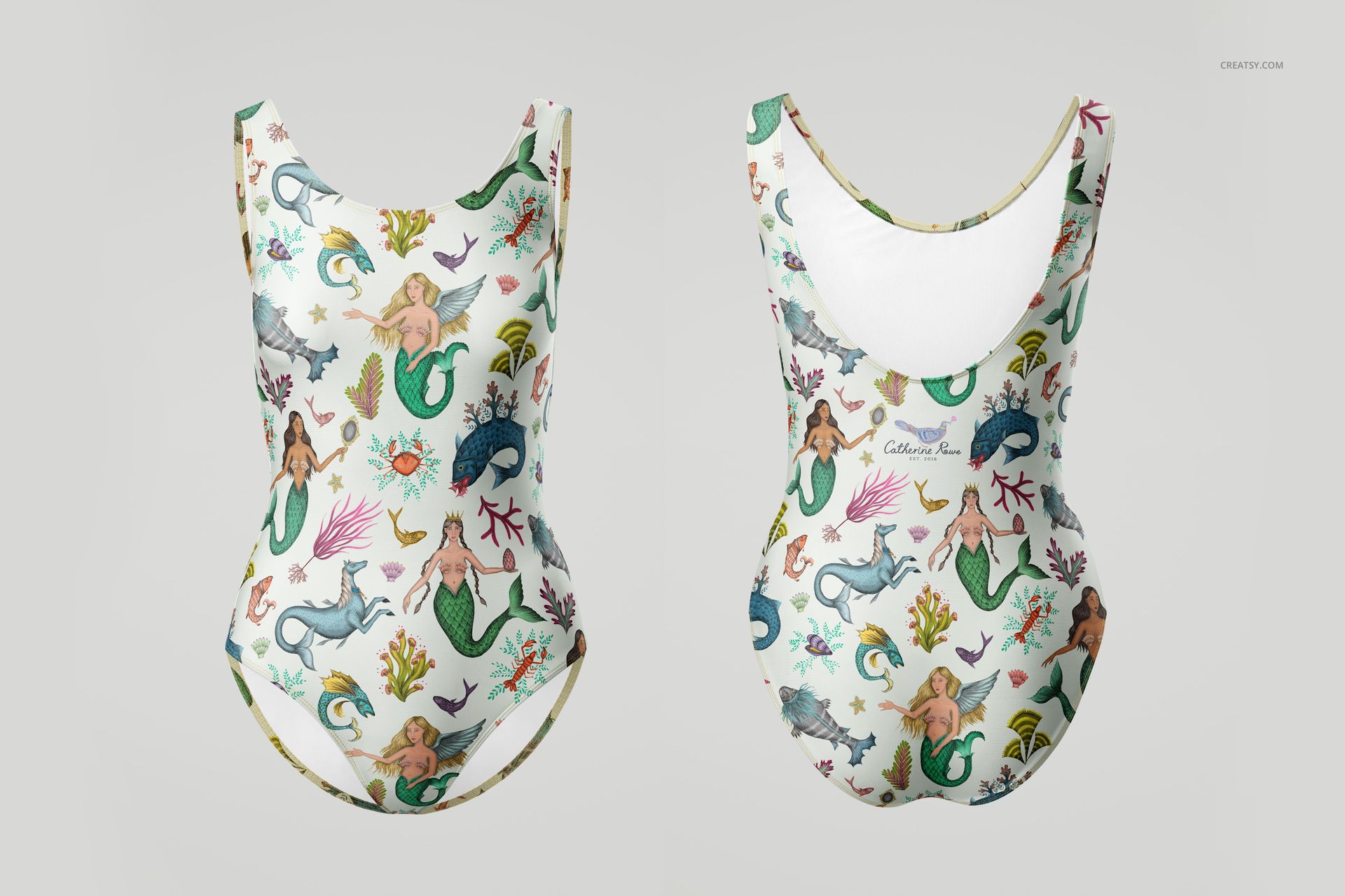 PSD mockup showing a swimsuit laid flat, decorated with playful sea creatures and mermaids in vibrant colors.