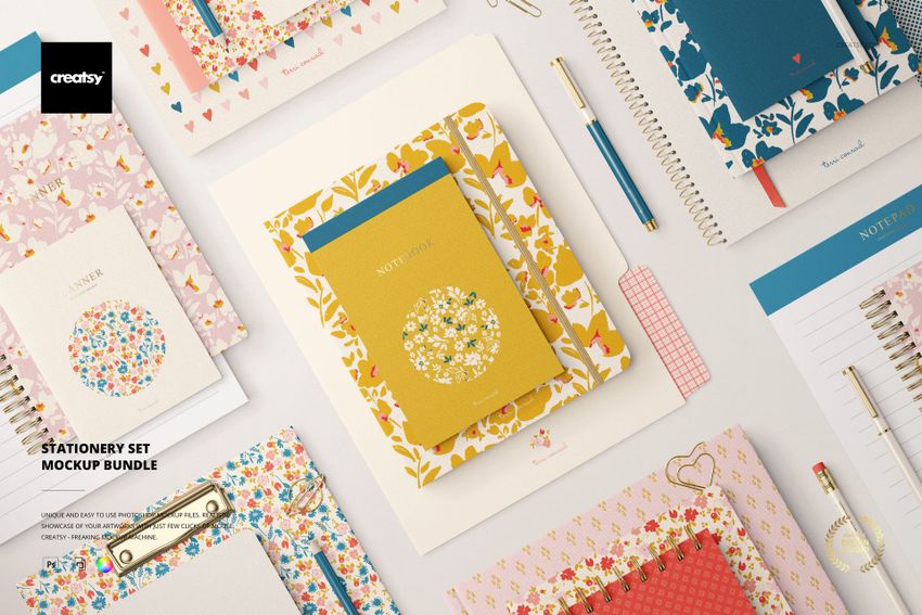 Assorted stationery mockup bundle displayed in a flat lay, highlighting patterned covers and organized paper goods.