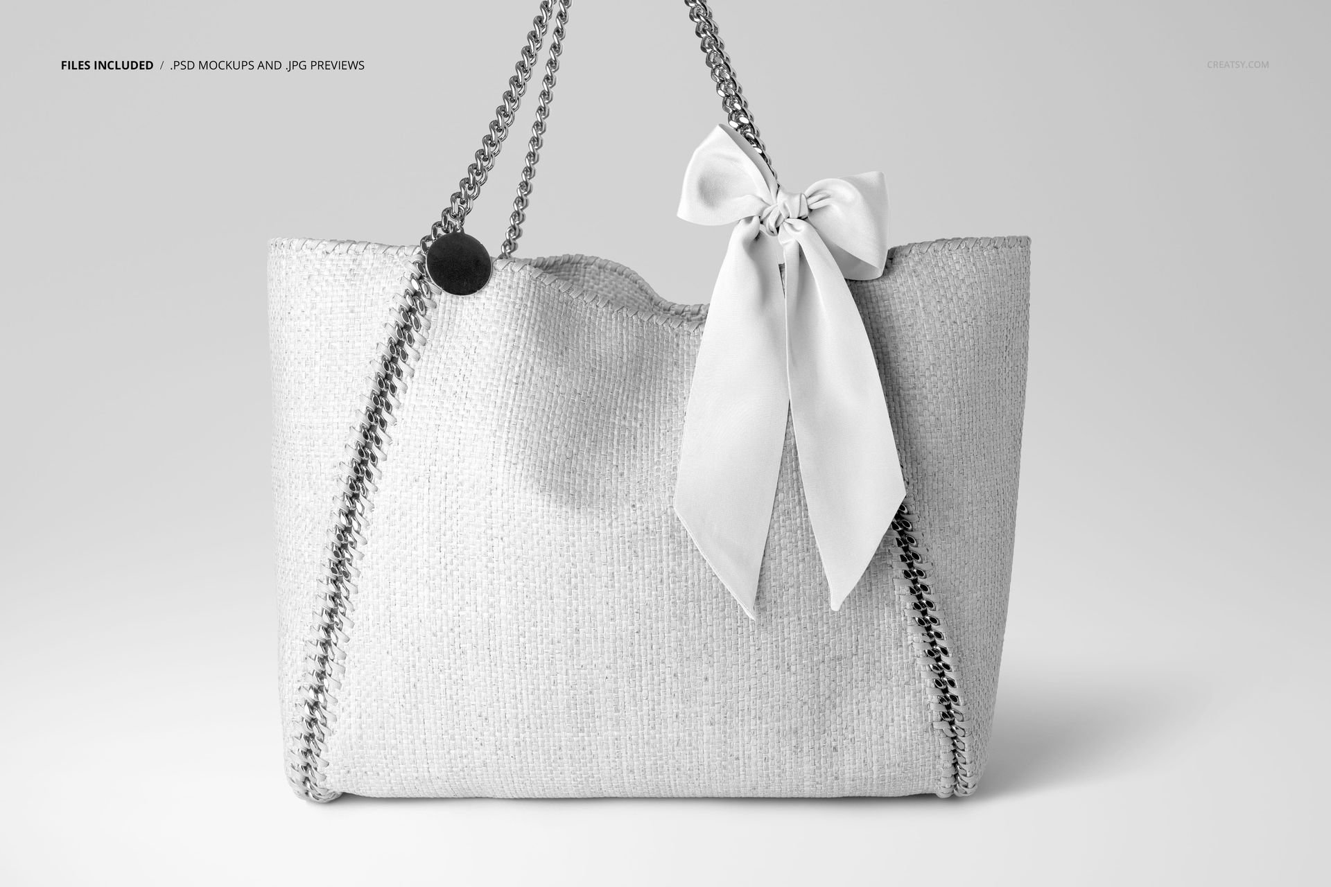 Fashion accessory mockup showing a tote bag with a metal chain strap and a white scarf bow detail on the handle.