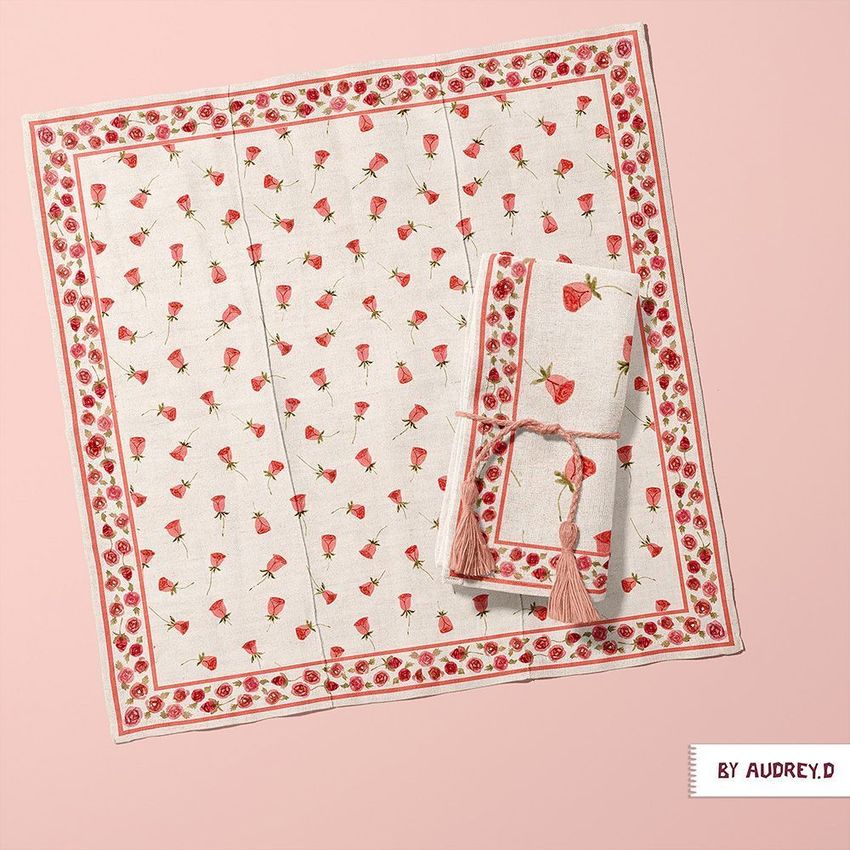 Cotton linen napkin mockup featuring a folded and an unfolded napkin with a strawberry and floral pattern on a pale pink background.