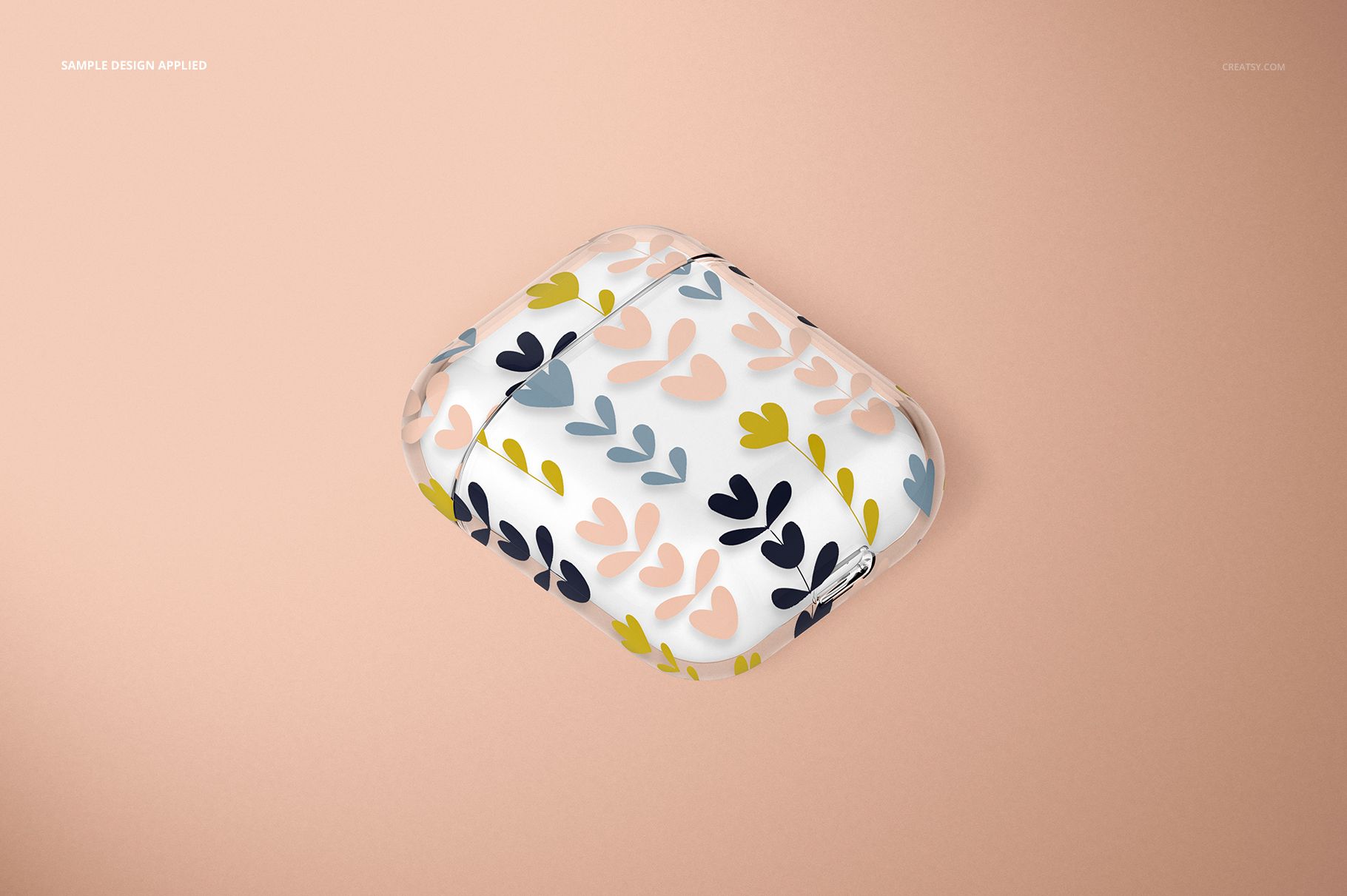 AirPods clear case mockup featuring soft pink, blue, and yellow leaf shapes, displayed on a beige surface.