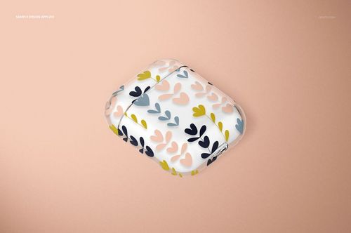 AirPods clear case mockup featuring soft pink, blue, and yellow leaf shapes, displayed on a beige surface.